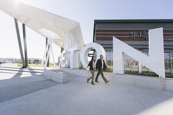 Residents walking at Seton community in Calgary, Alberta