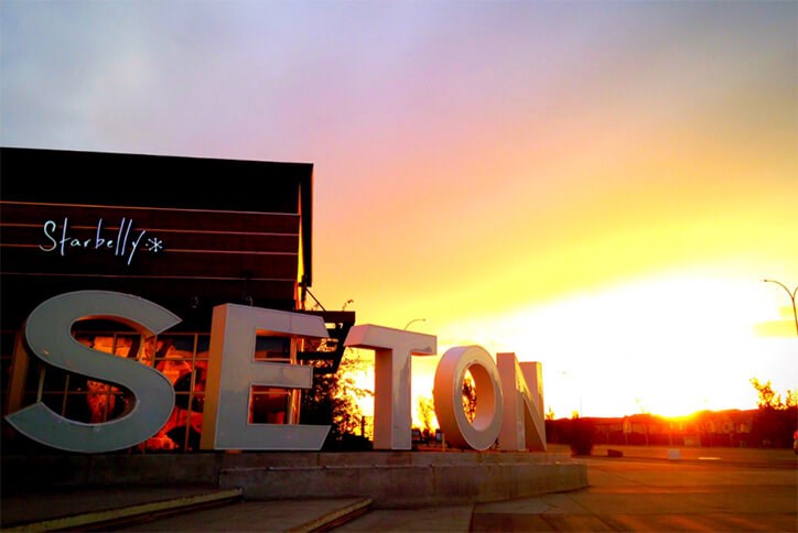 Signage of Seton community in Calgary, Alberta at sunset