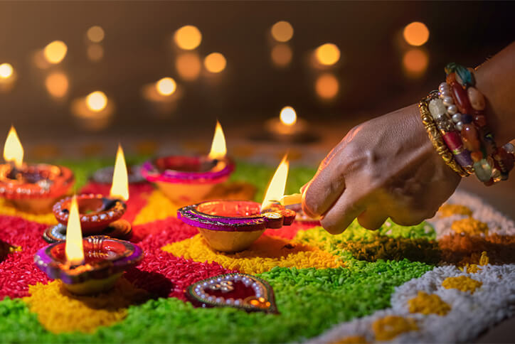 Lighting candles to celebrate Diwali at Seton in Calgary, Alberta