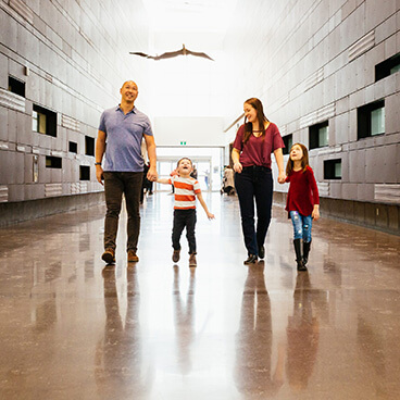 Family in Seton Community by Brookfield Residential in Southeast Calgary